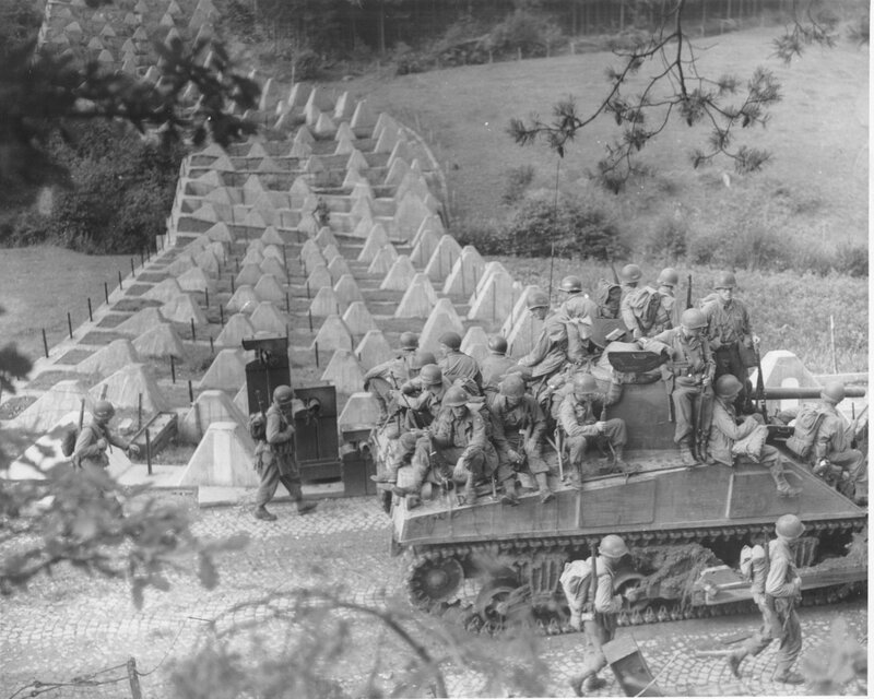 Soldiers with tank near bunkers