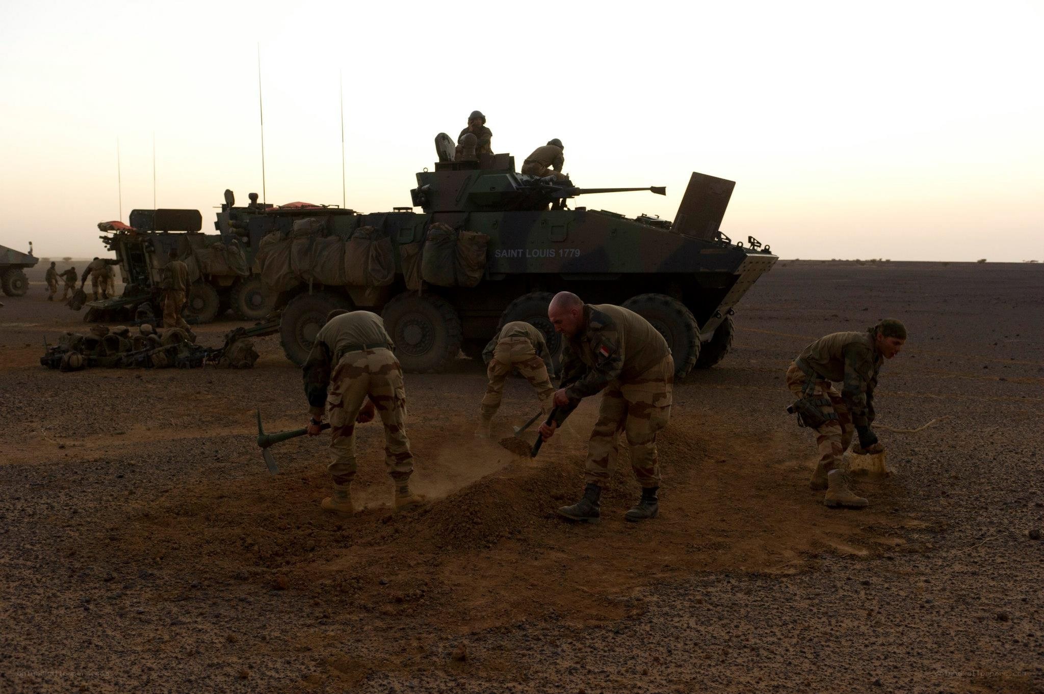 Soldiers working in desert
