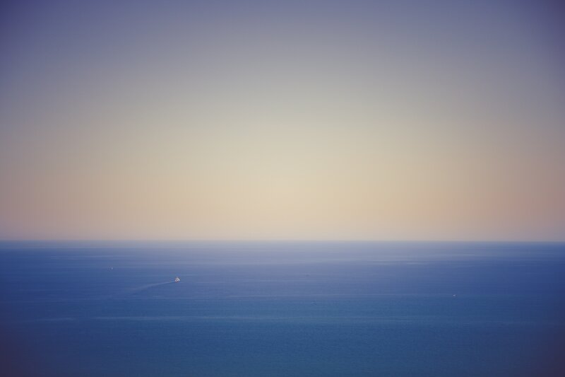 solitary boat on calm sea