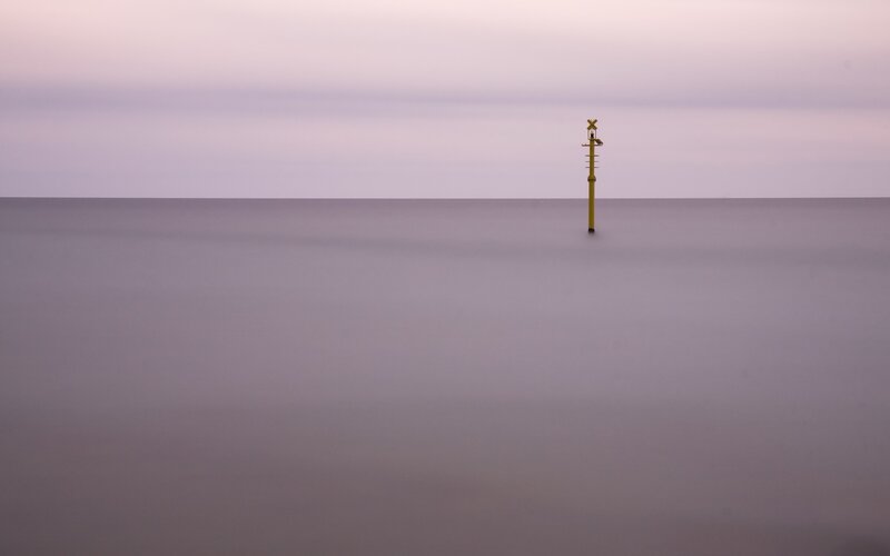 Solitary buoy at dusk