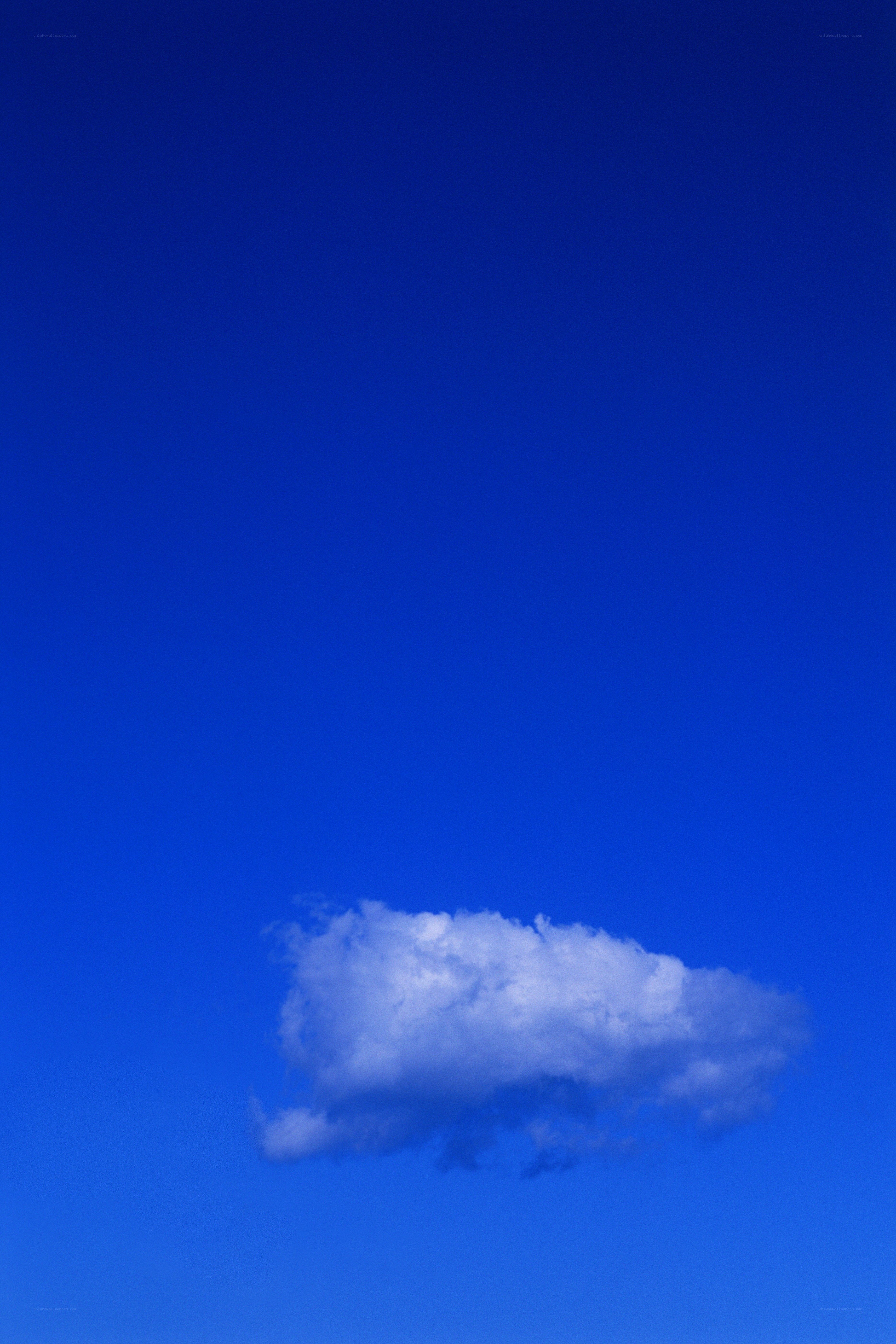 solitary cloud in blue sky
