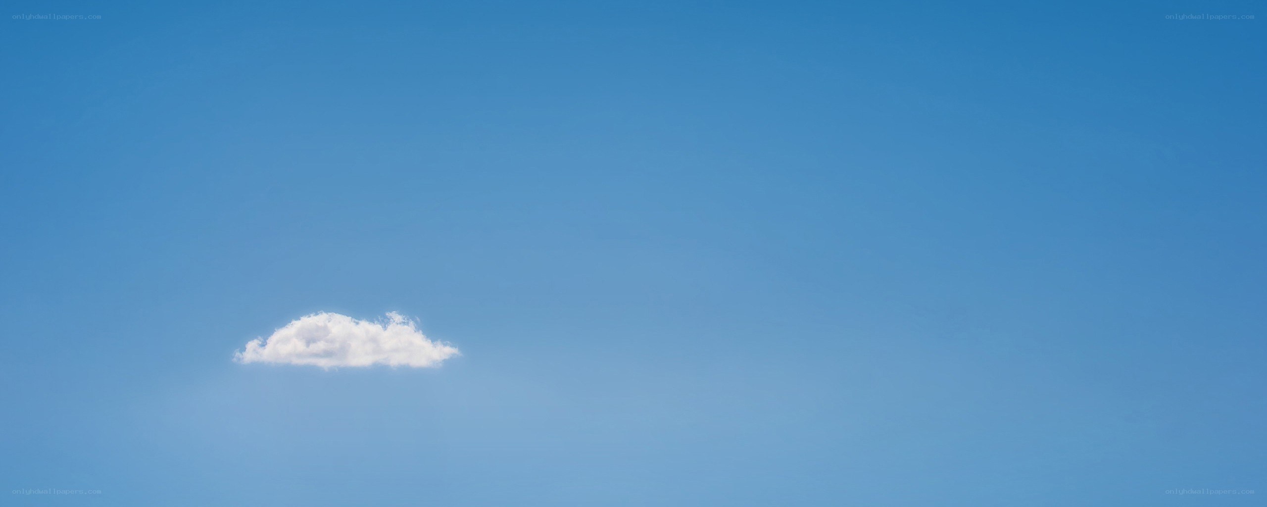 solitary cloud in blue sky