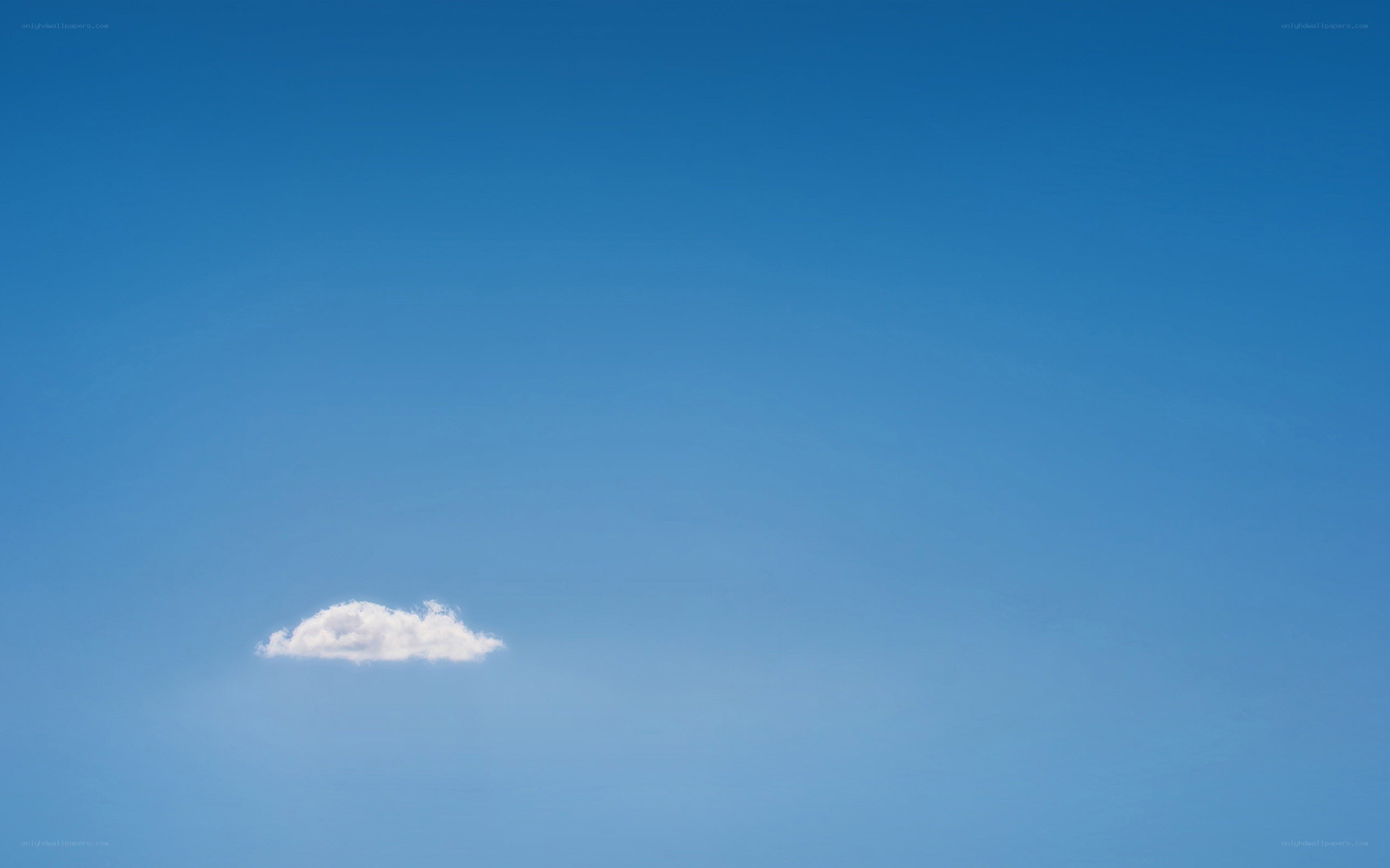 solitary cloud in blue sky