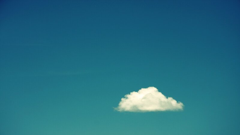solitary cloud in blue sky