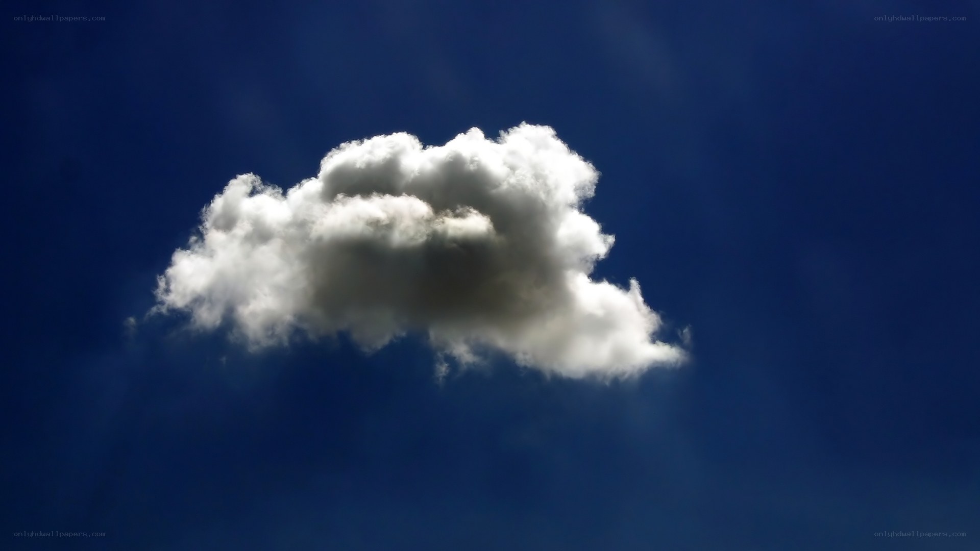 solitary cloud in blue sky