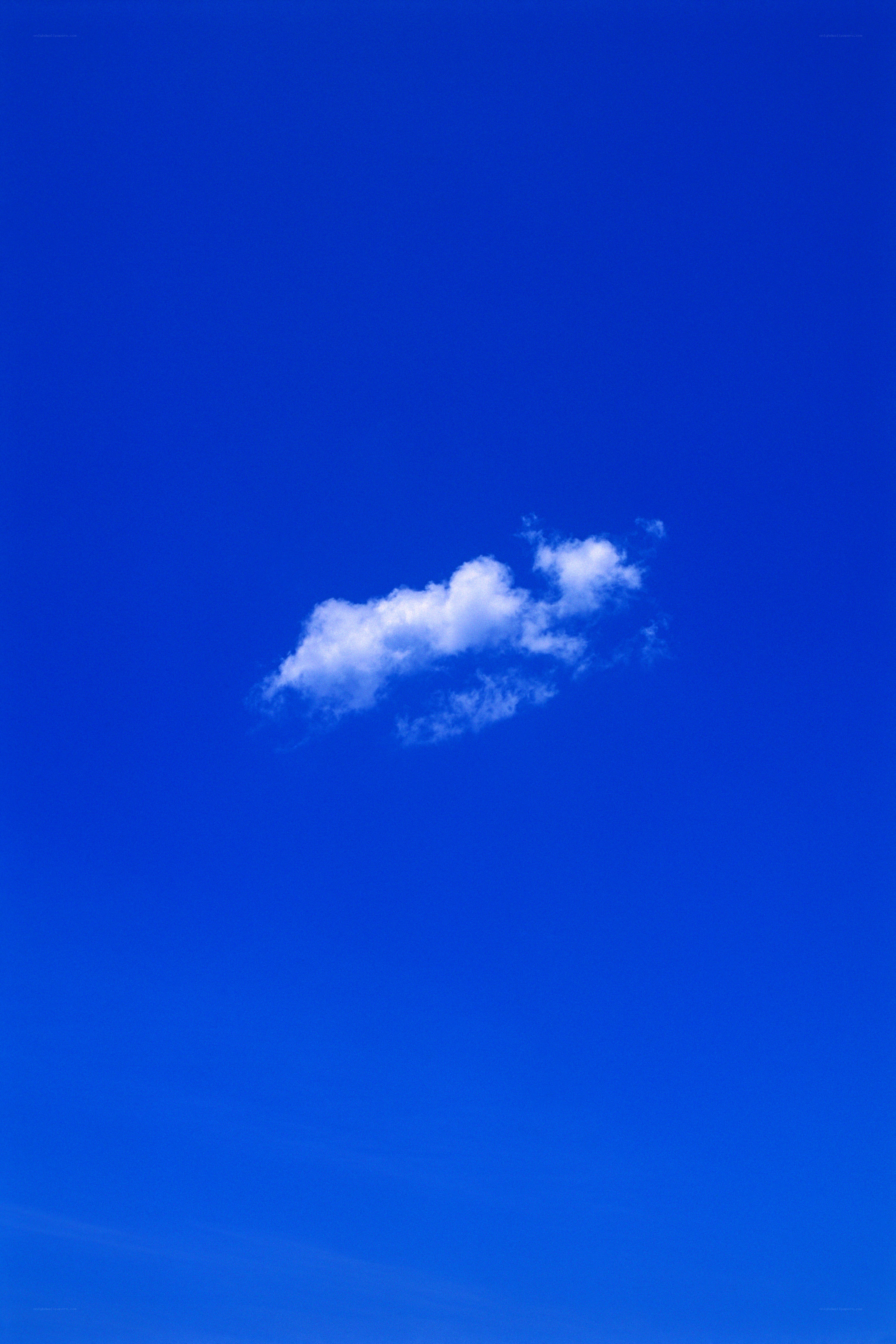 solitary cloud in blue sky