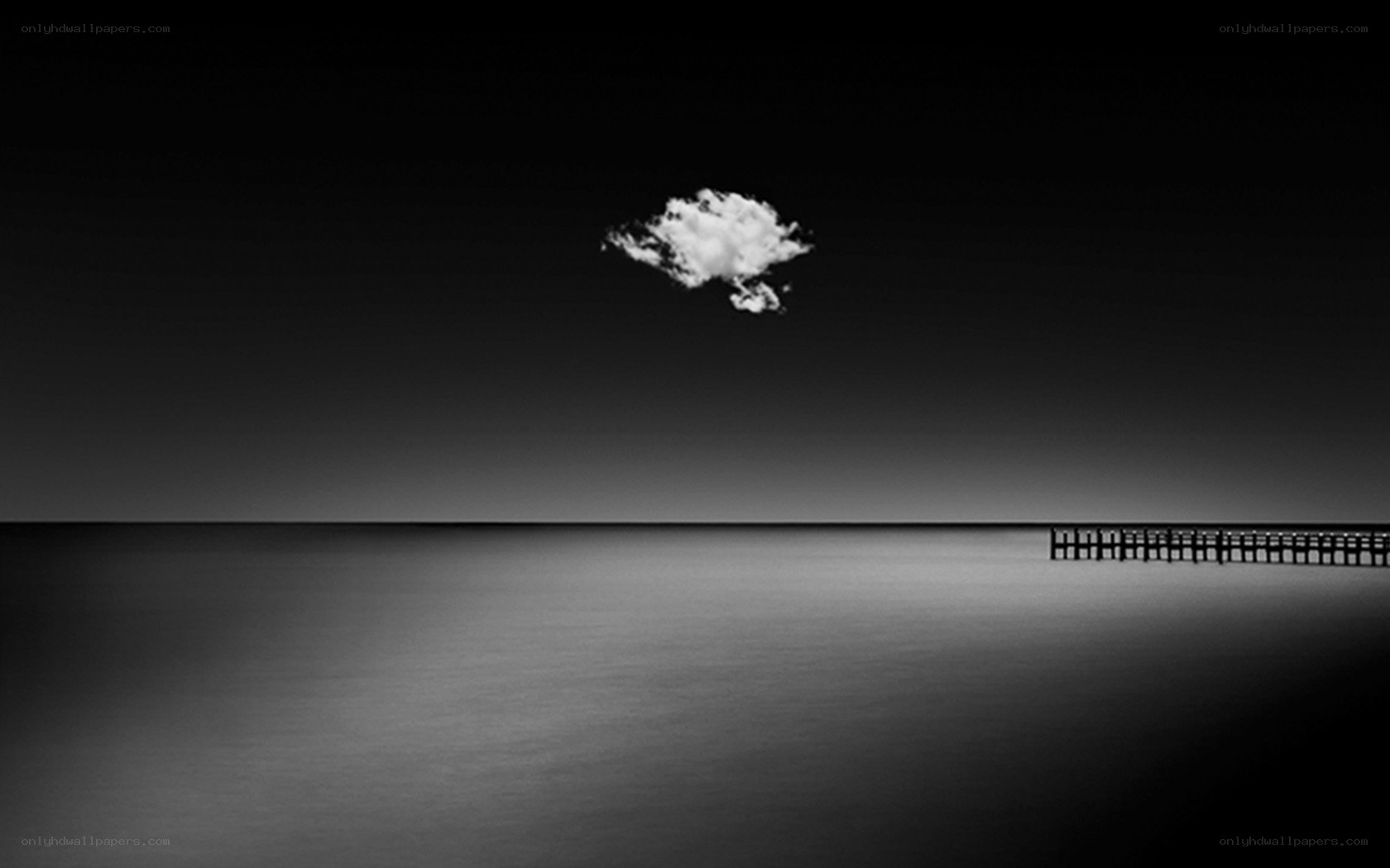 solitary cloud over calm sea