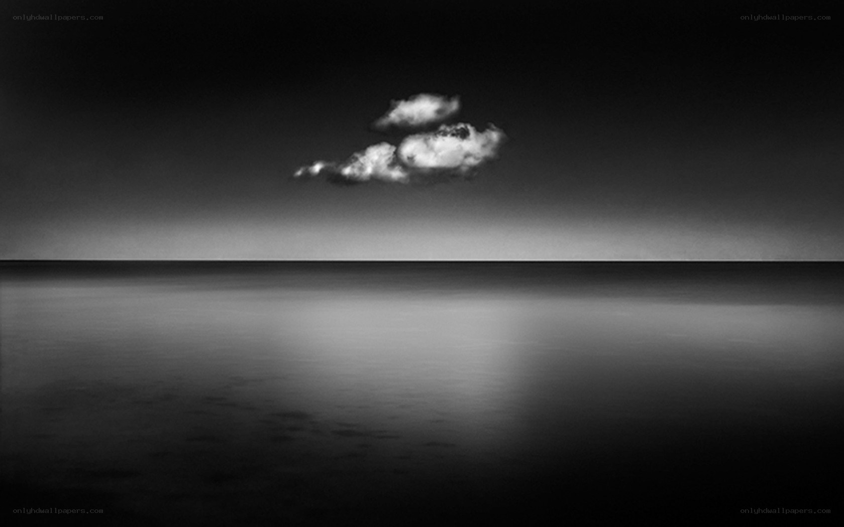 solitary cloud over calm sea