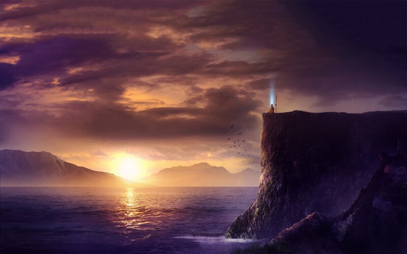 Solitary figure on a cliff at sunset