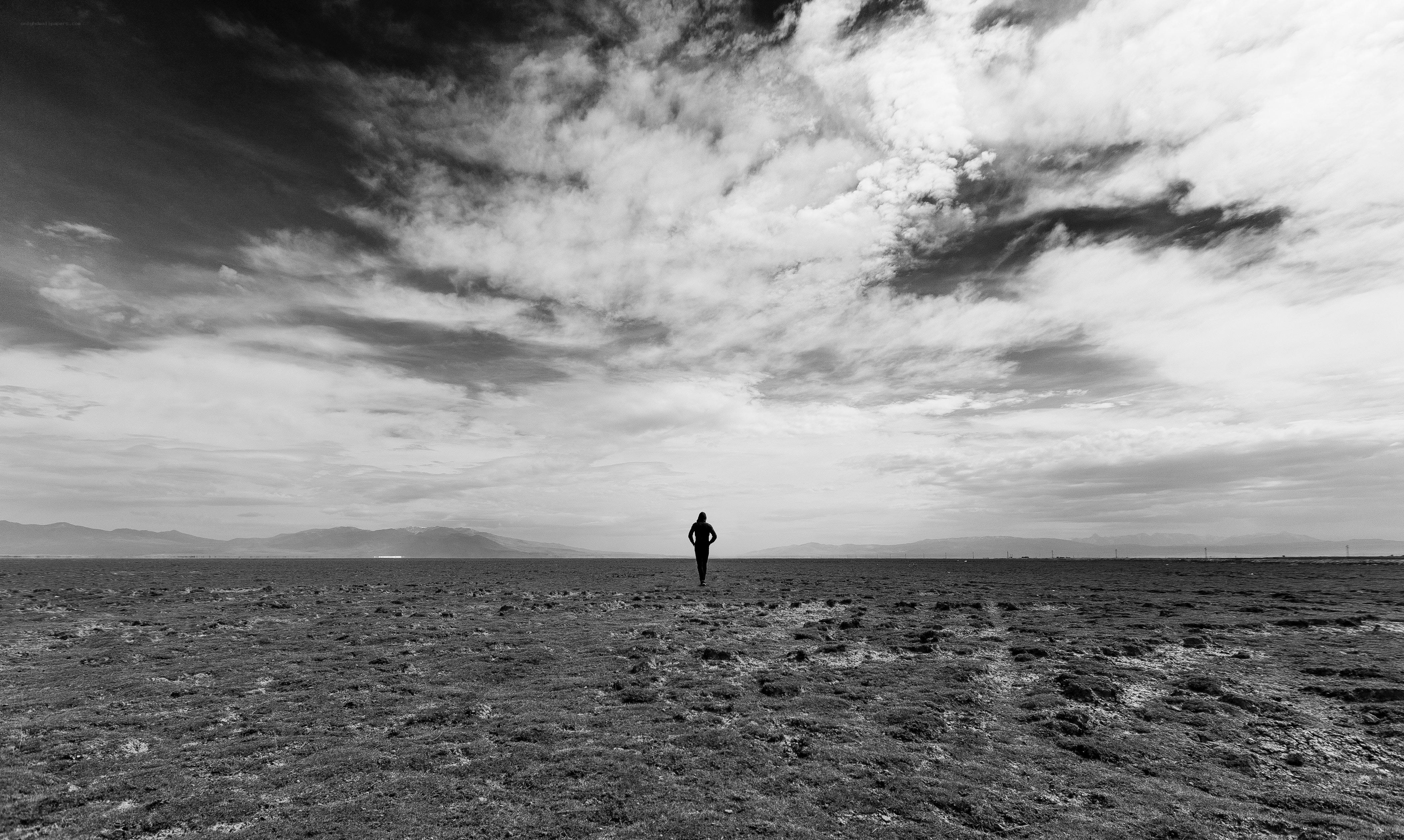 solitary figure on vast plain