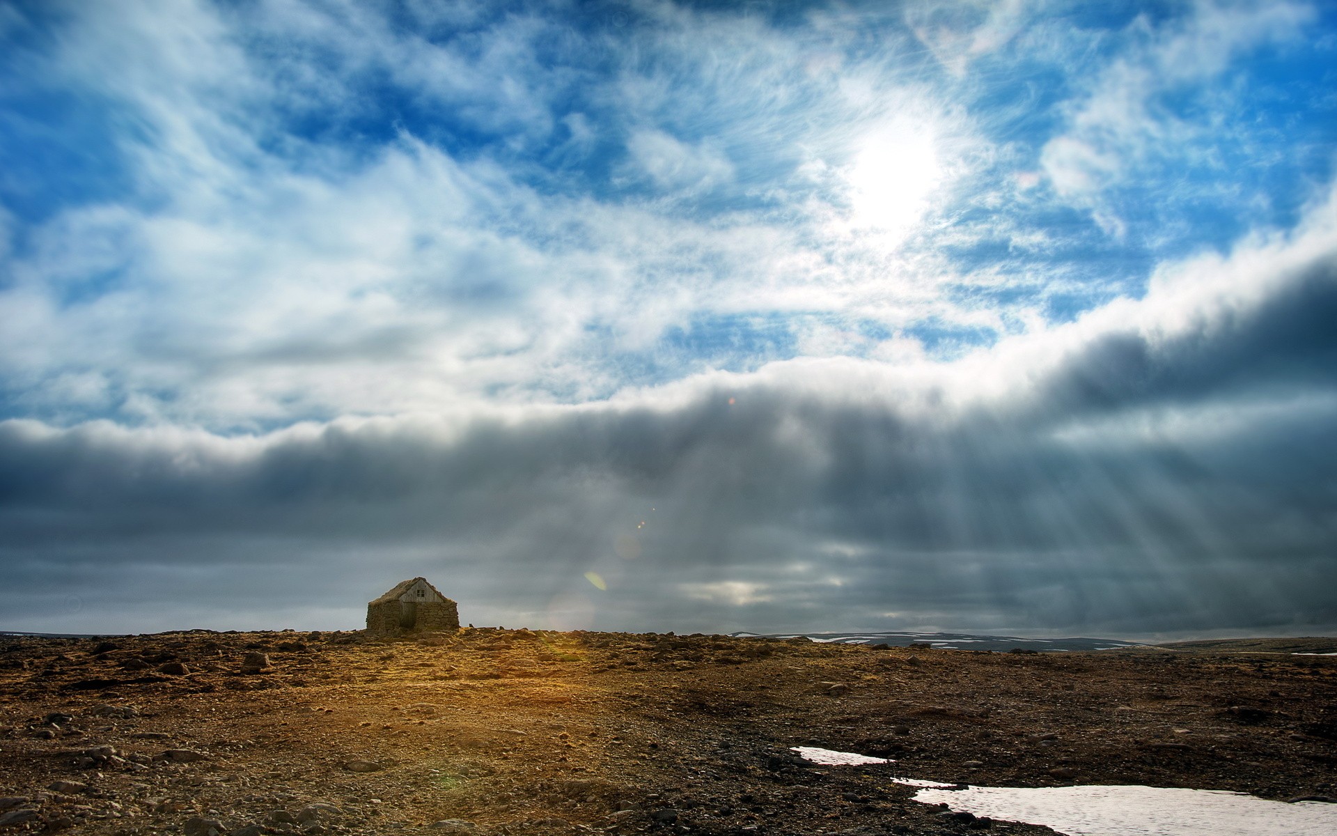 Solitary hut under dramatic sky
