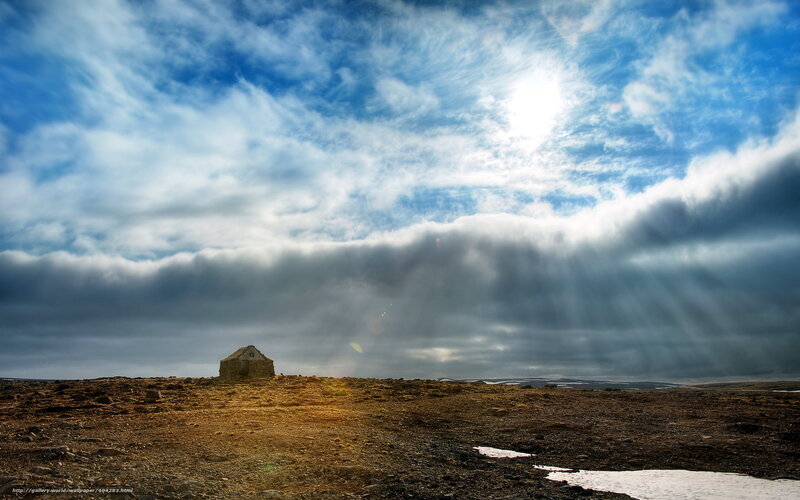 Solitary hut under dramatic sky