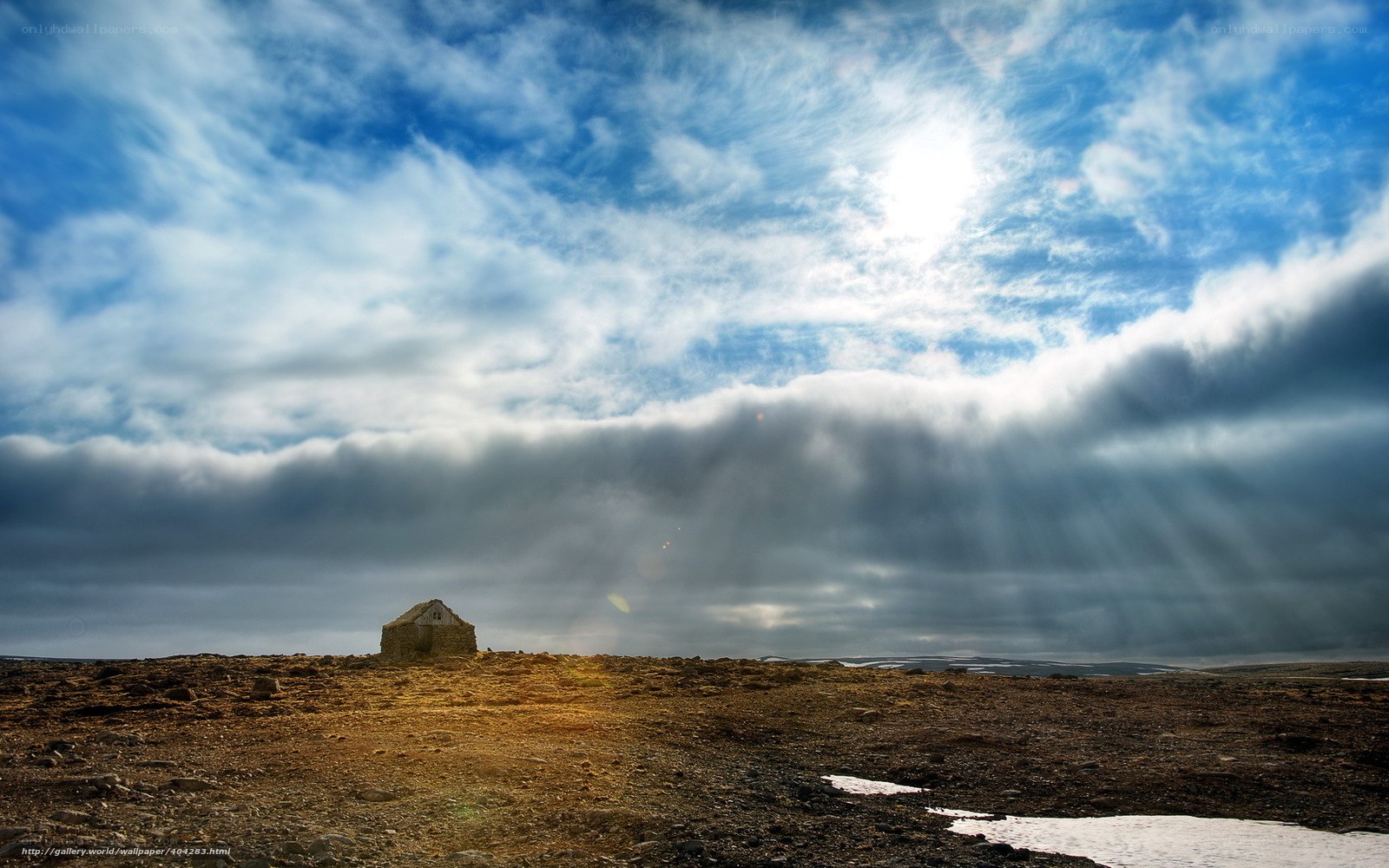 Solitary hut under dramatic sky