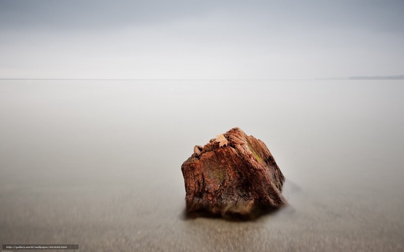 solitary rock in calm water