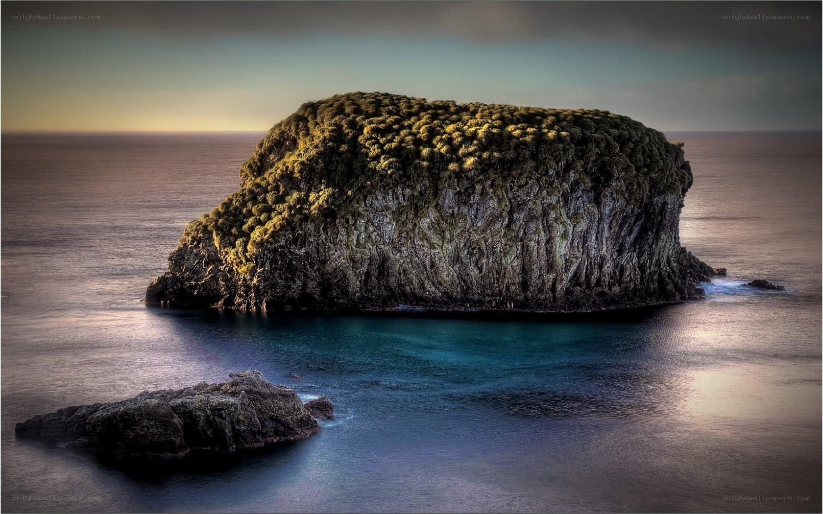 Solitary sea stack at dusk