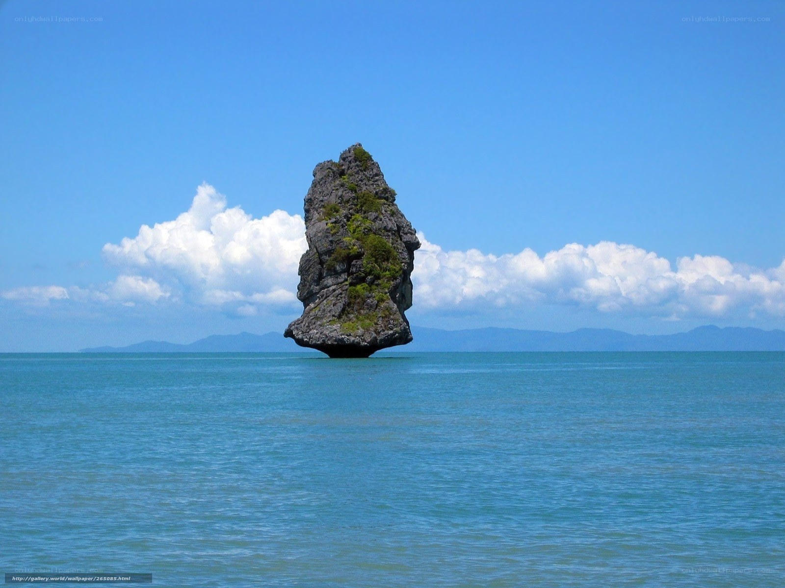 Solitary sea stack in blue waters