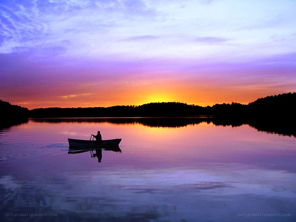 Solo boat at sunset