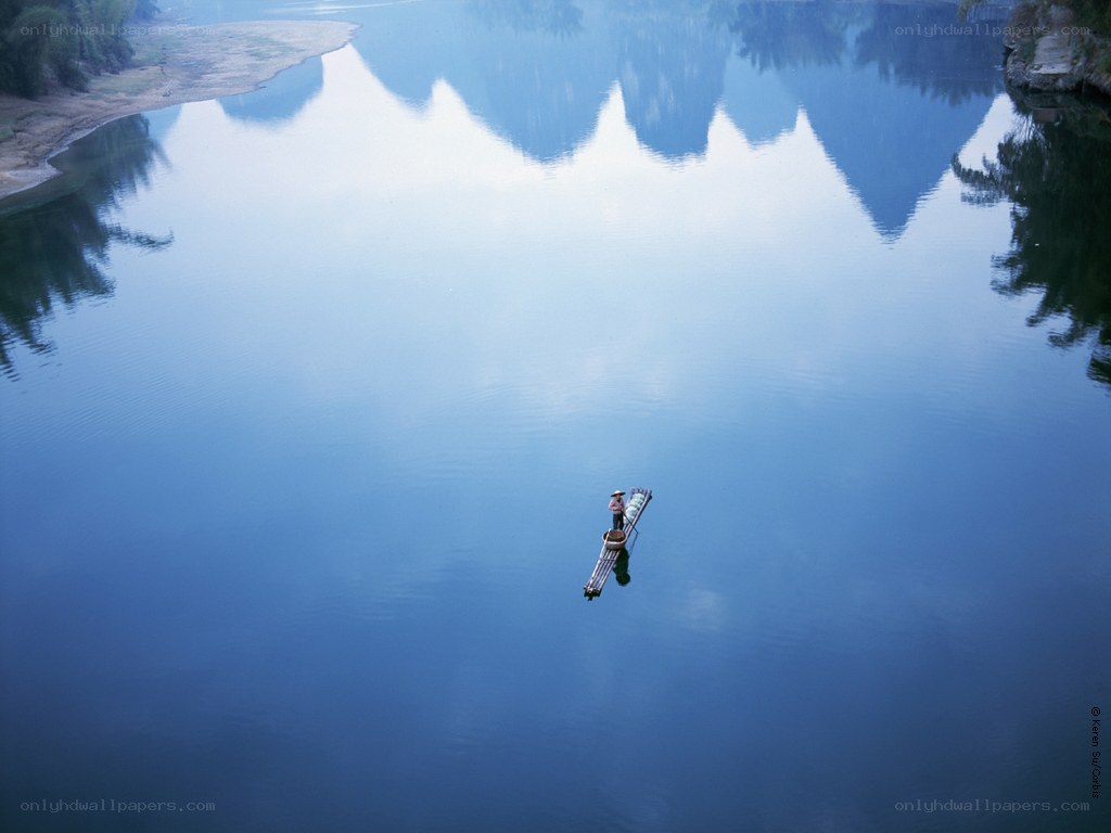 Solo boat on calm river