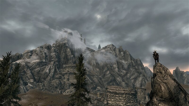 solo figure on a mountain peak