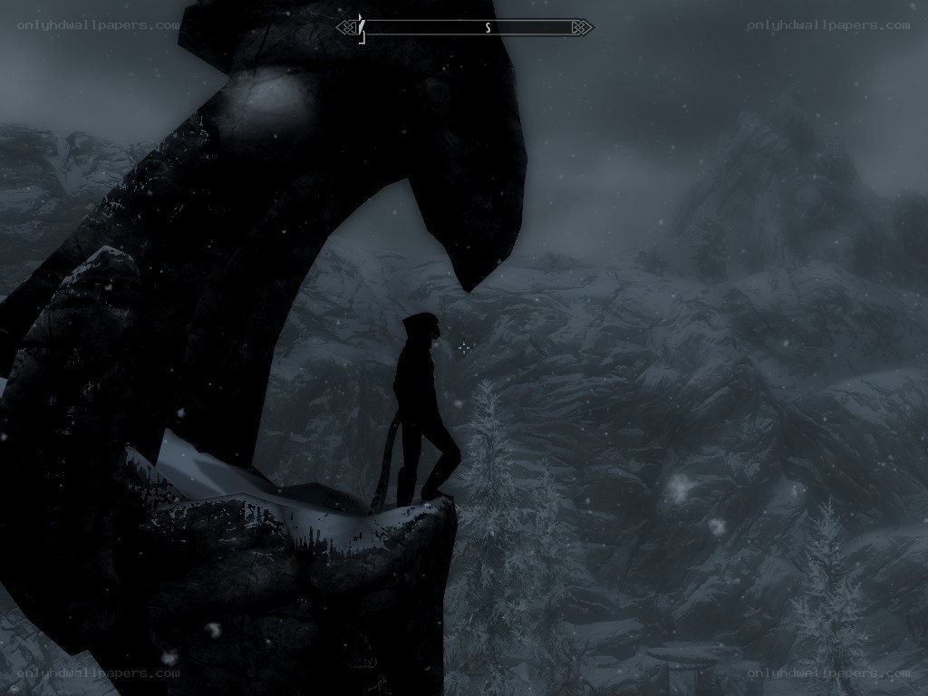 solo figure on snowy cliff