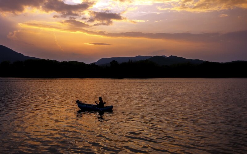 Solo kayaker at sunset