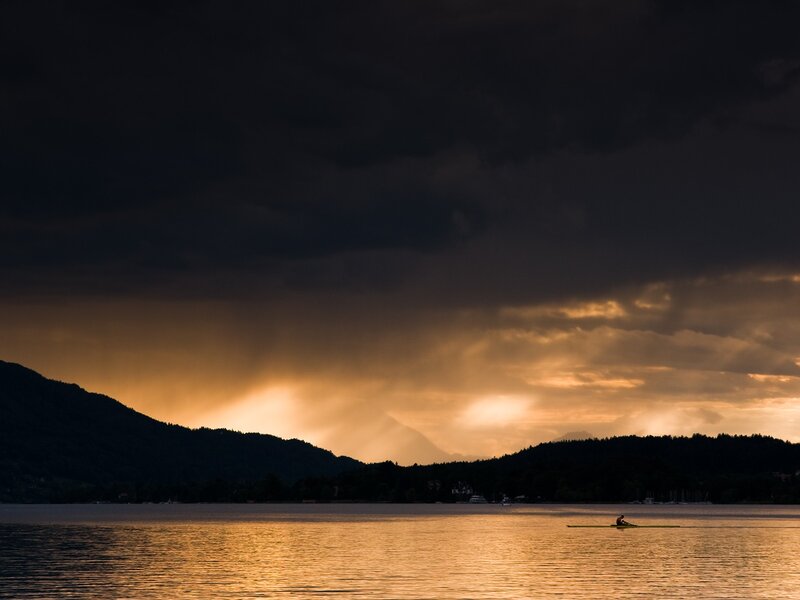 Solo rower at sunset