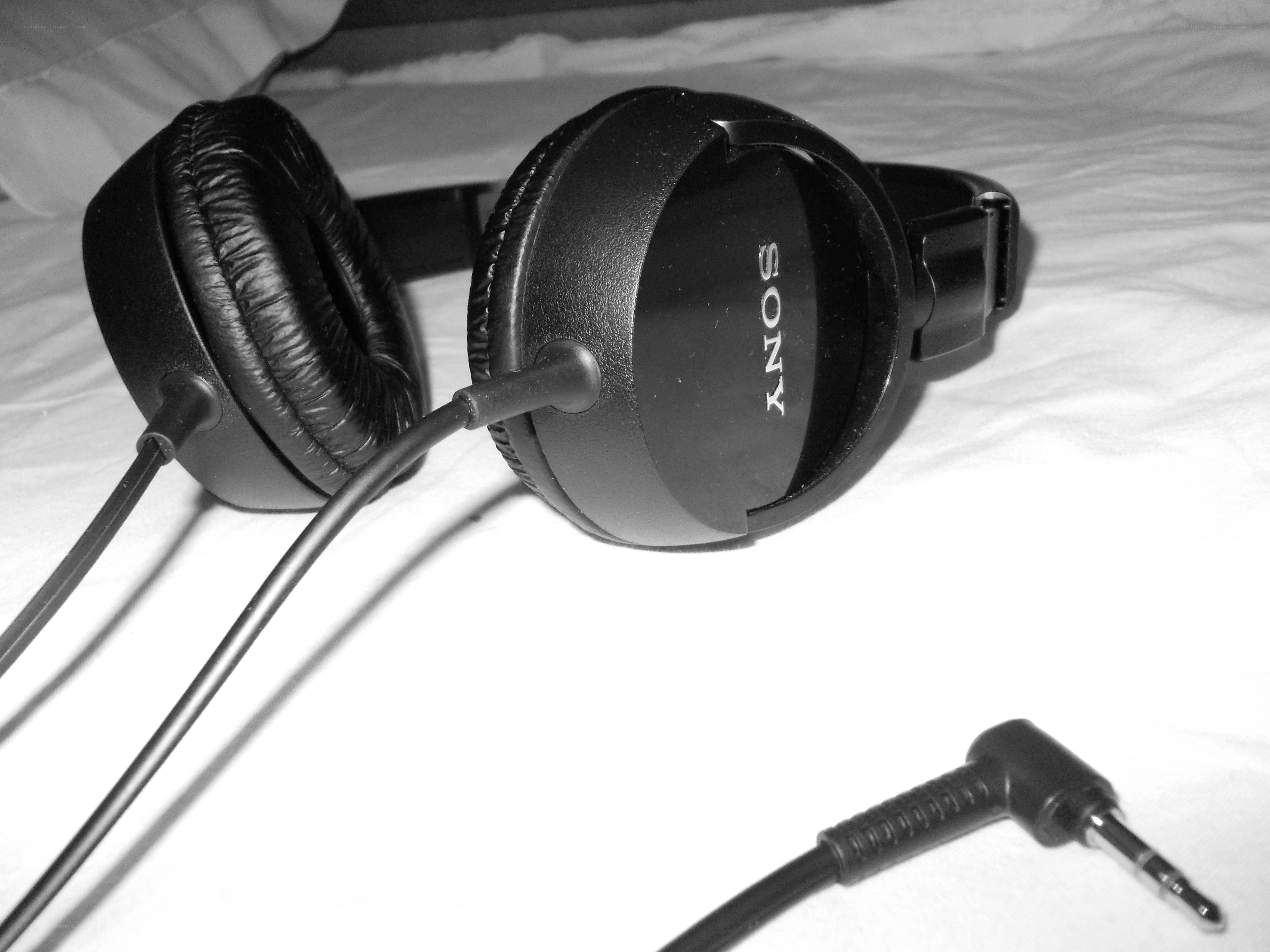 Sony headphones on a bed