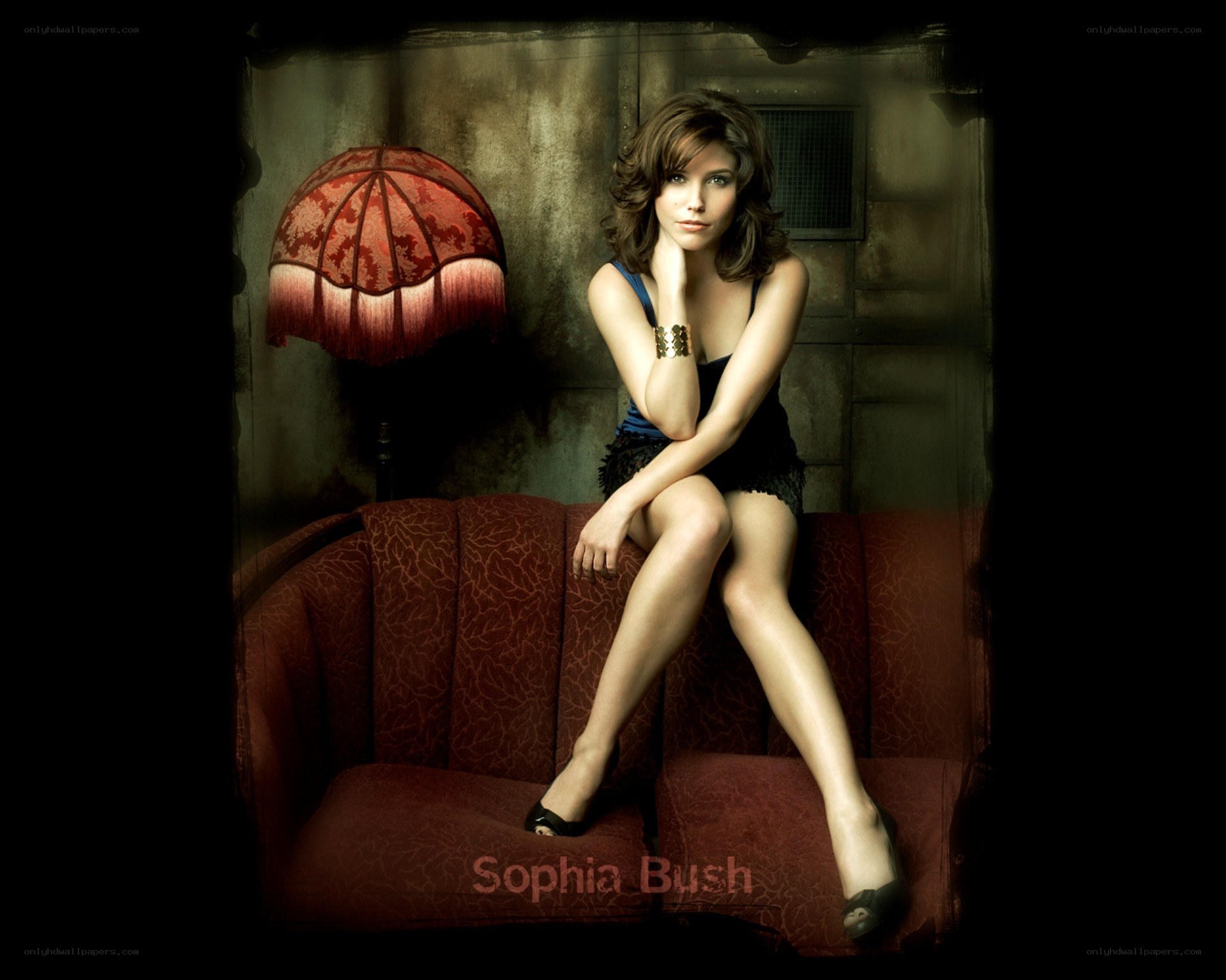 Sophia Bush on a red couch
