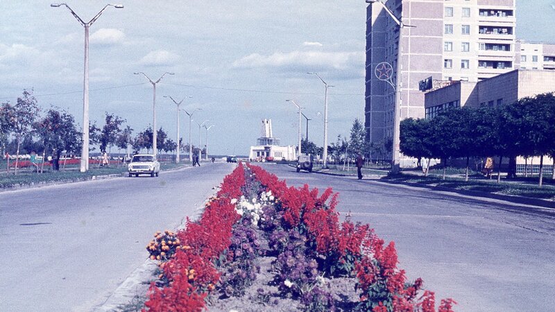 Soviet-era city street with flowers