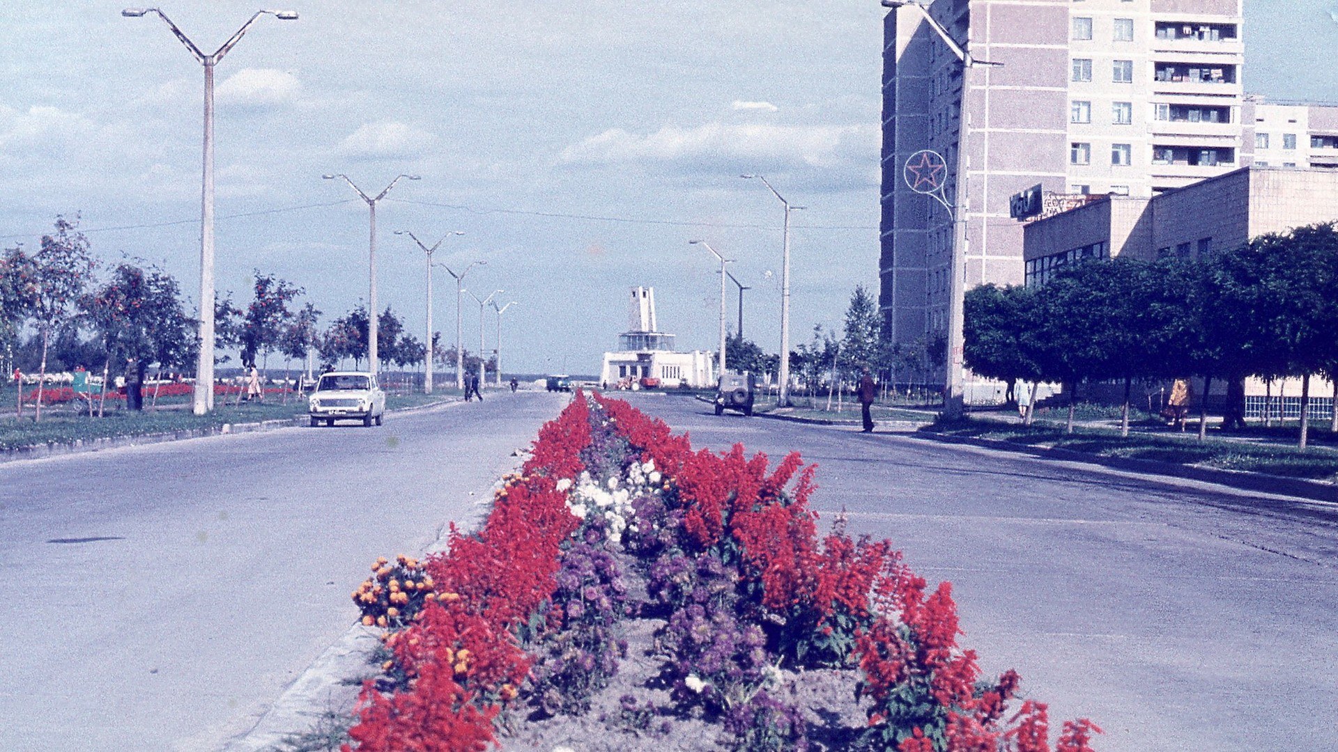 Soviet-era city street with flowers