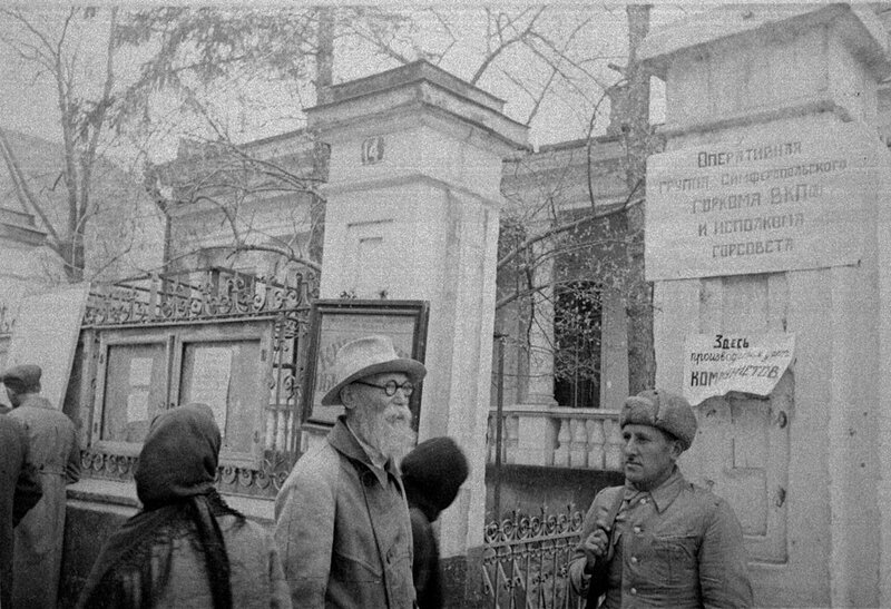 Soviet-era street scene with soldiers