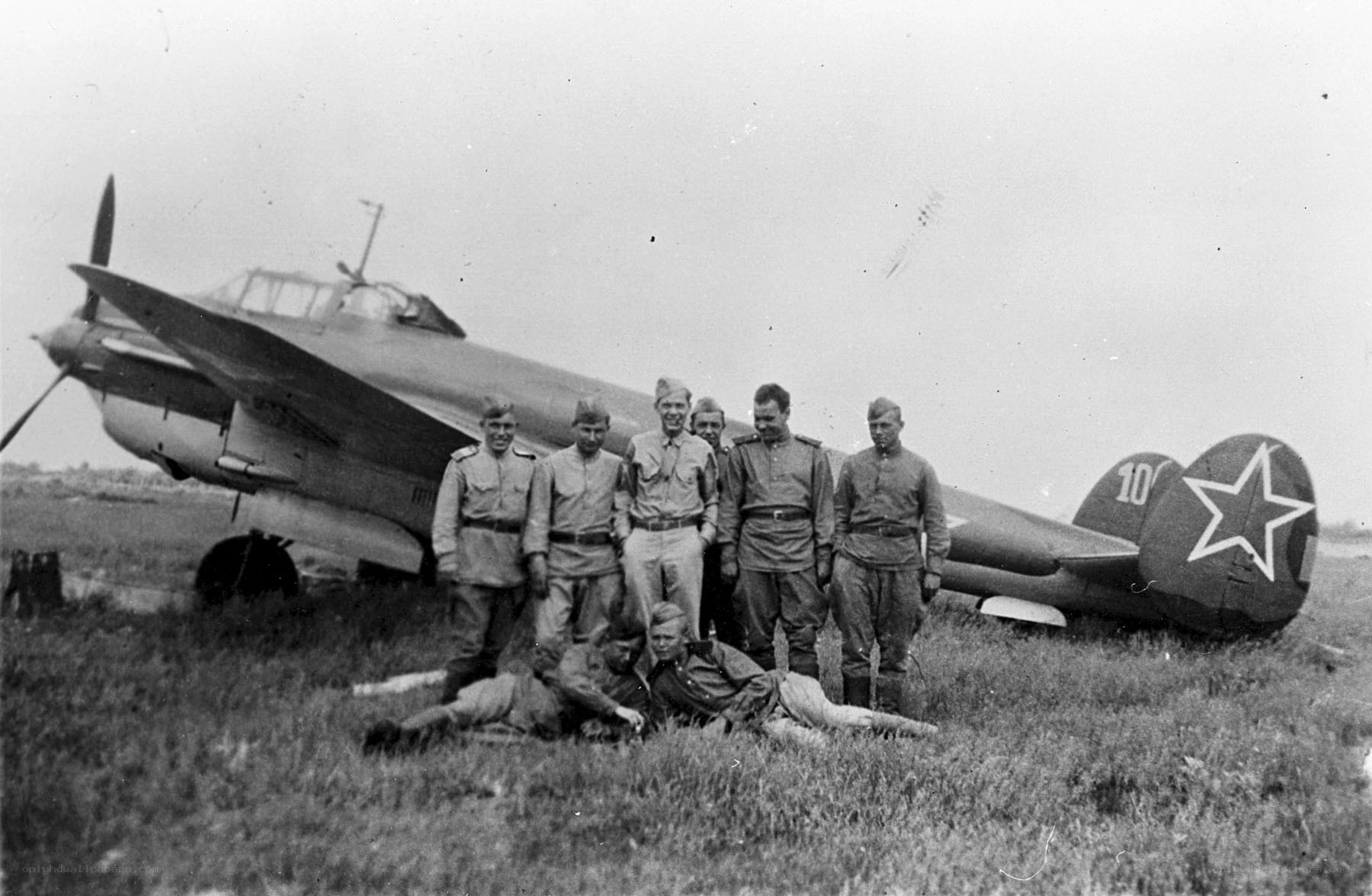 Soviet pilots with fighter plane