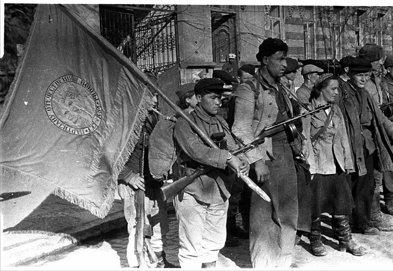 Soviet soldiers marching with flag