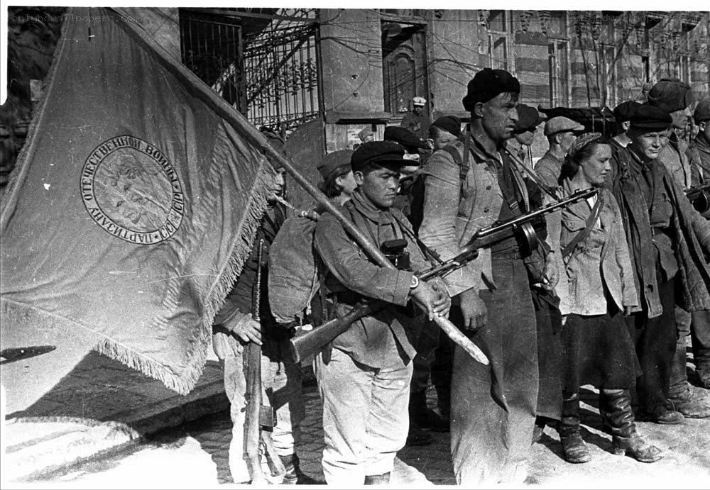 Soviet soldiers marching with flag