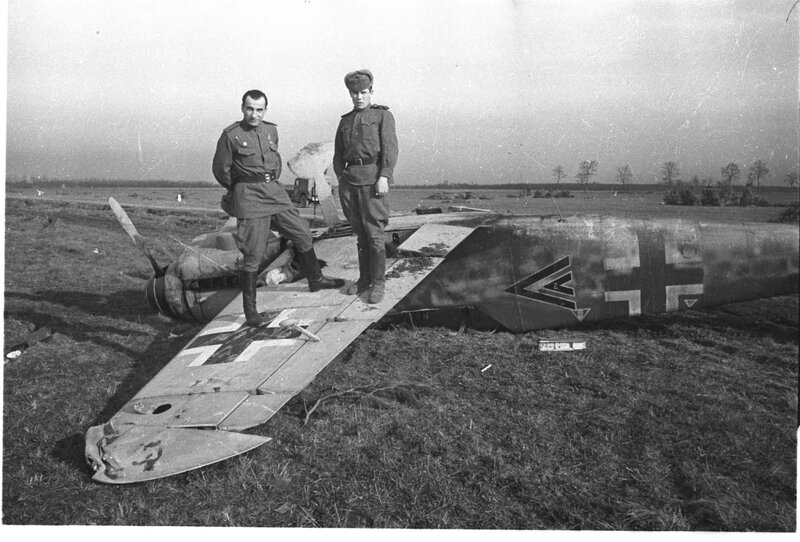 Soviet soldiers with downed German plane
