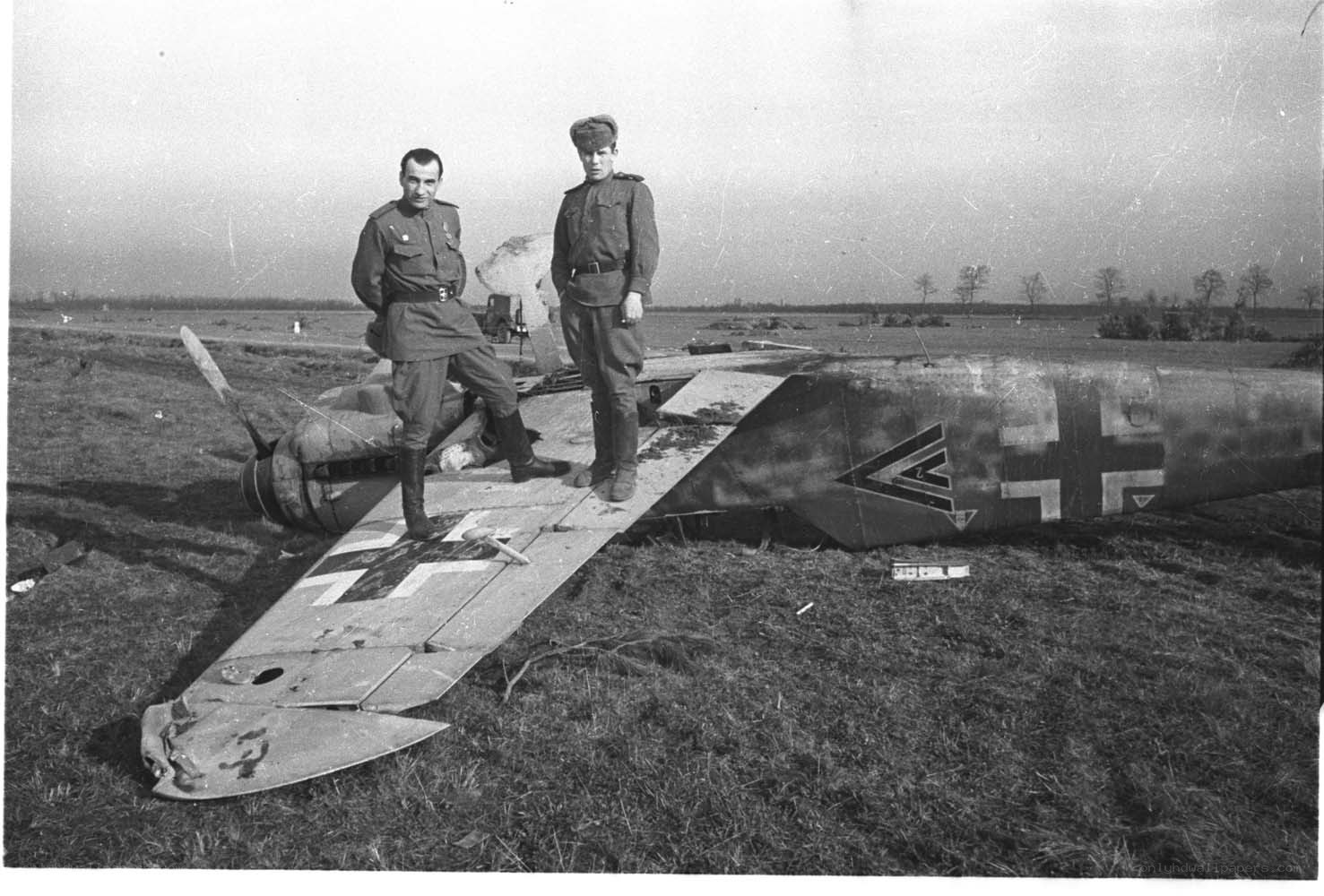 Soviet soldiers with downed German plane