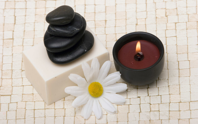 Spa arrangement with candle and stones