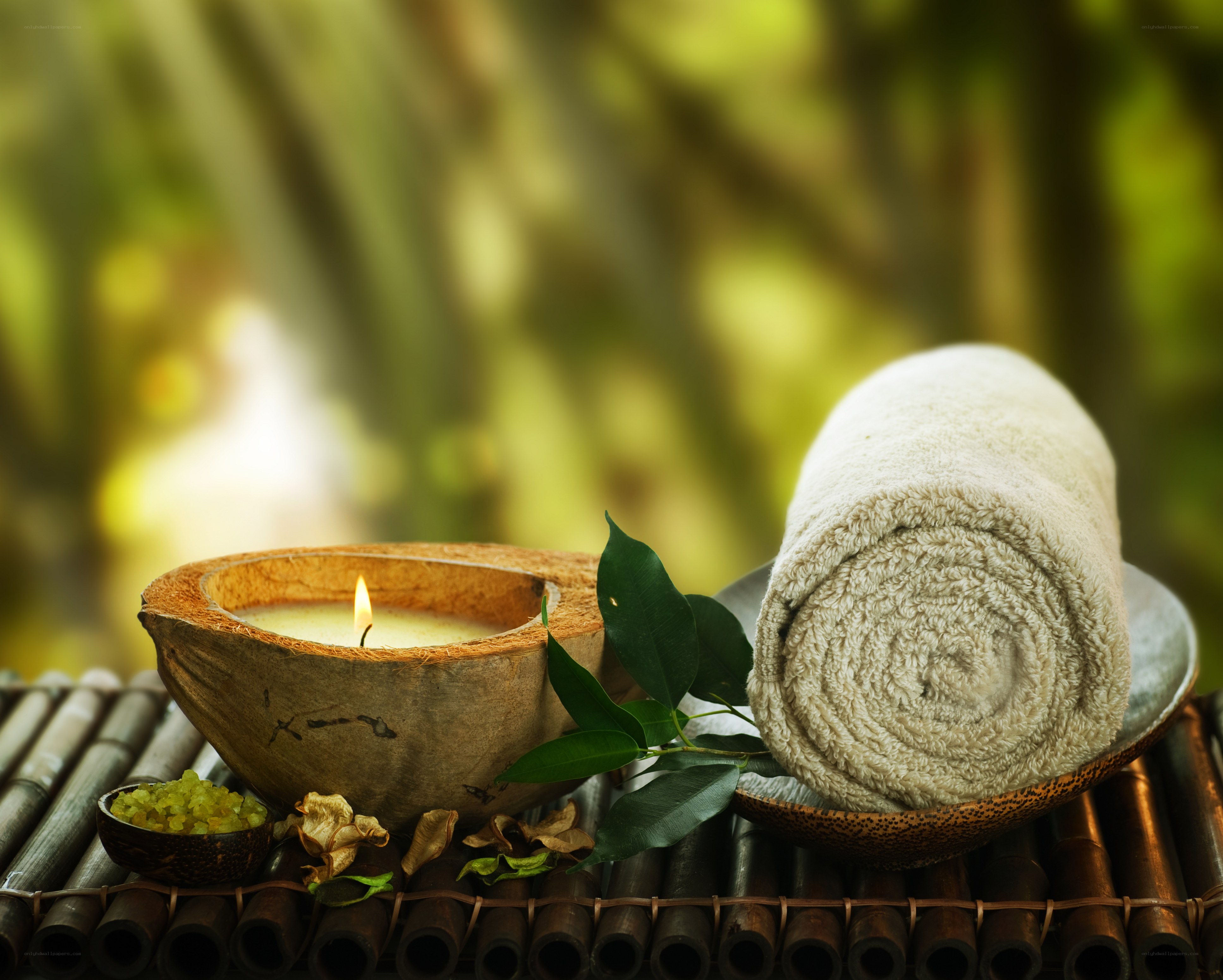 Spa setup with candle and towel