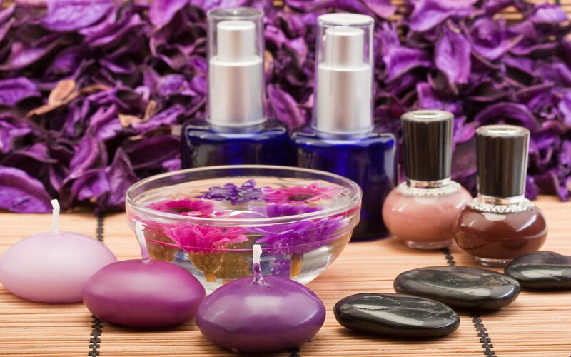 Spa setup with purple flowers