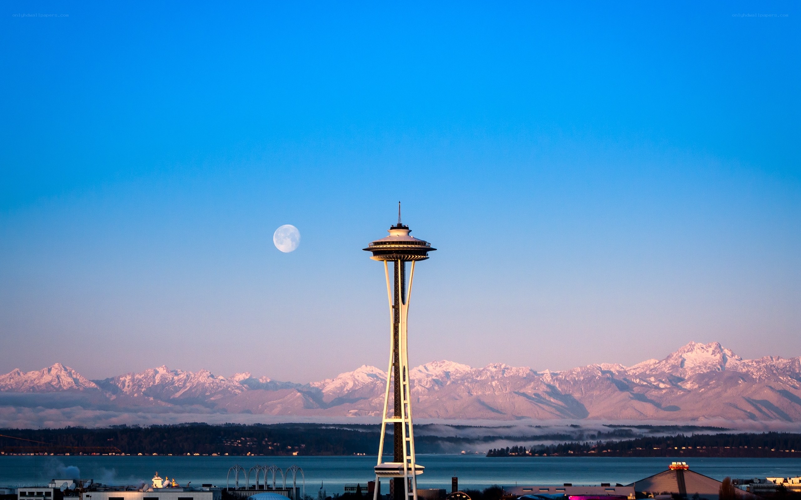 Space Needle with moon and mountains