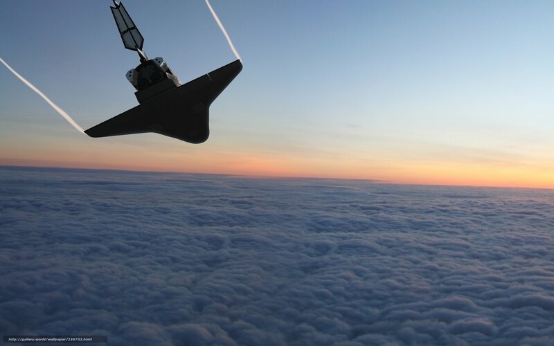space shuttle above clouds