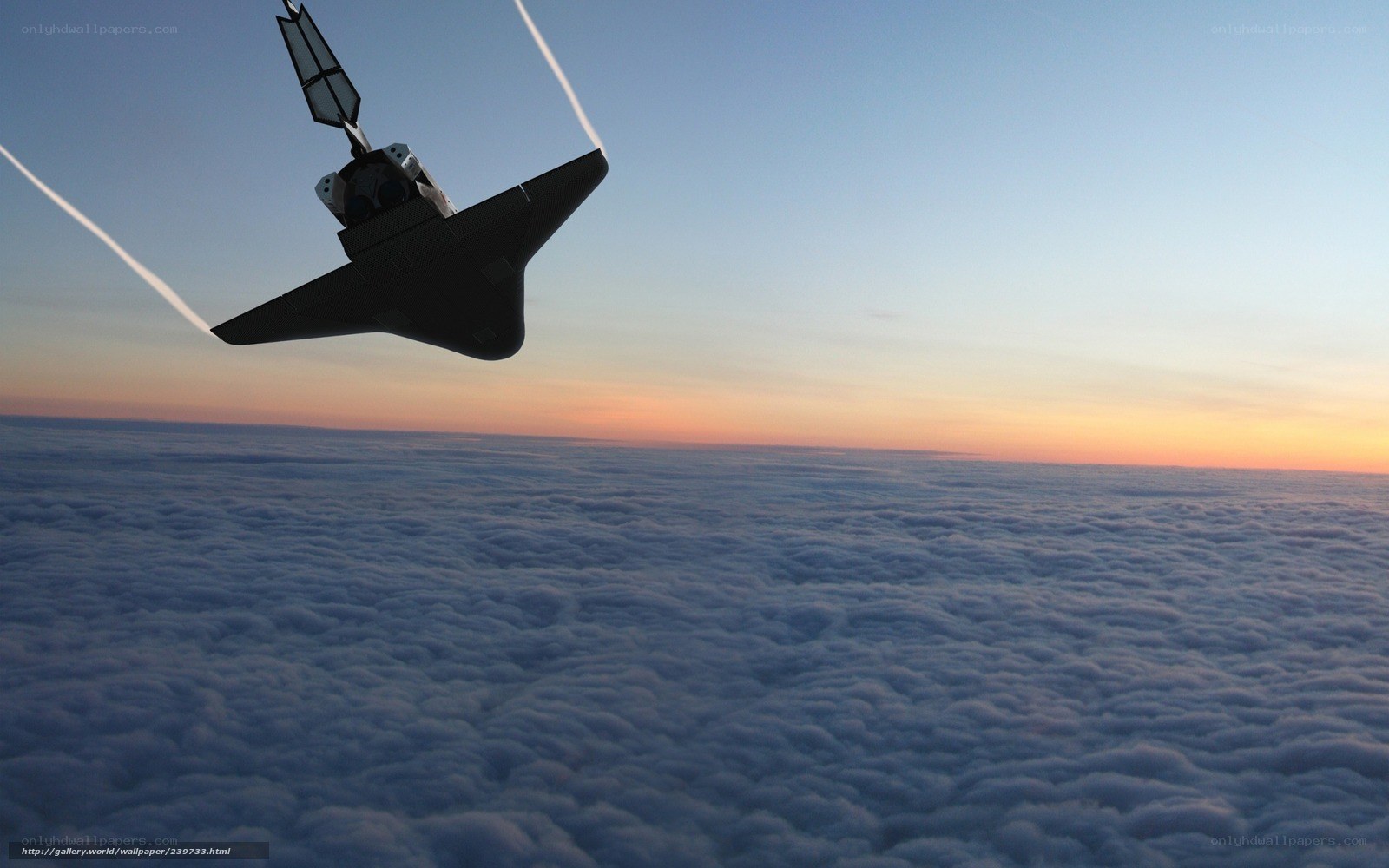 space shuttle above clouds