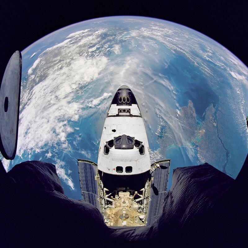 Space shuttle above Earth