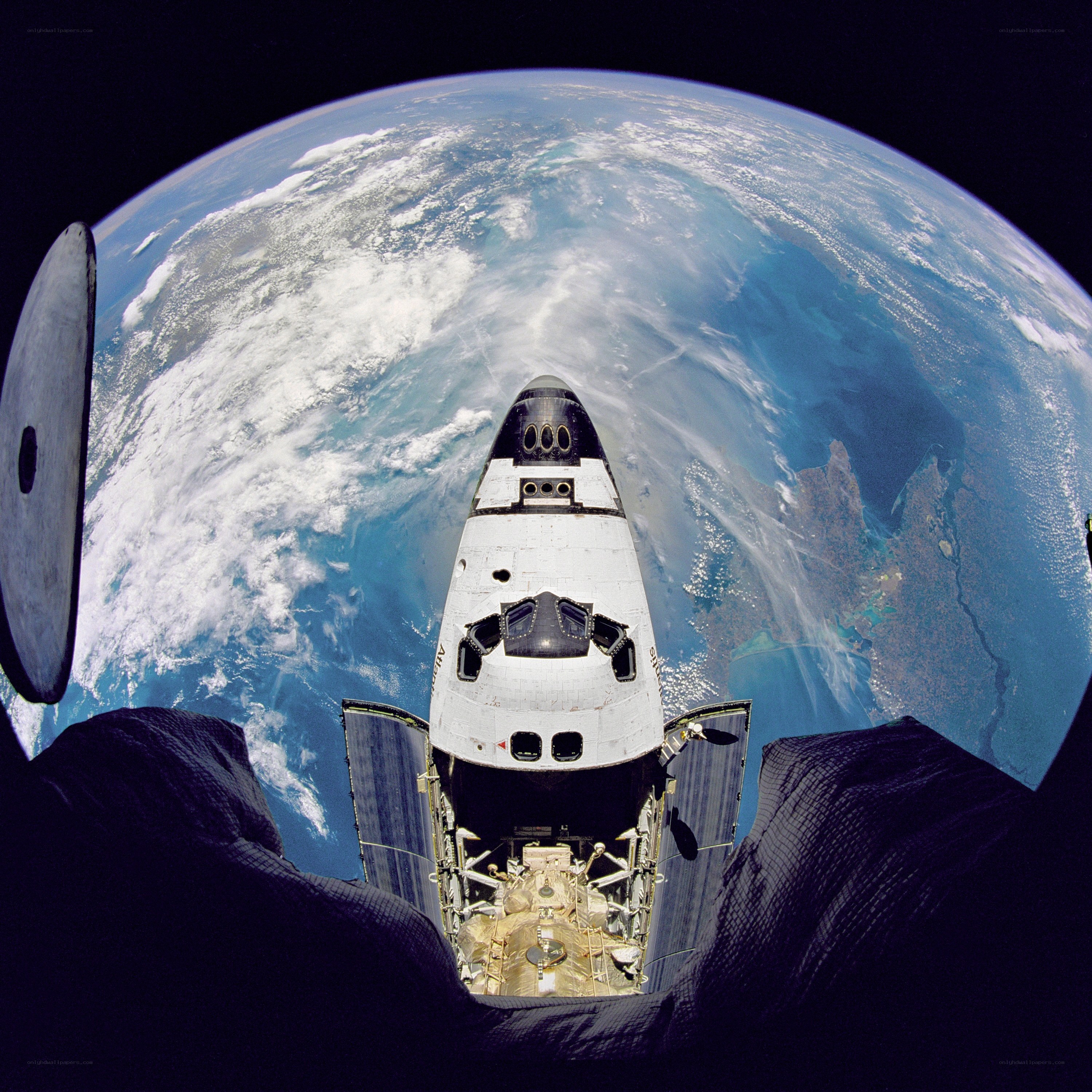 Space shuttle above Earth