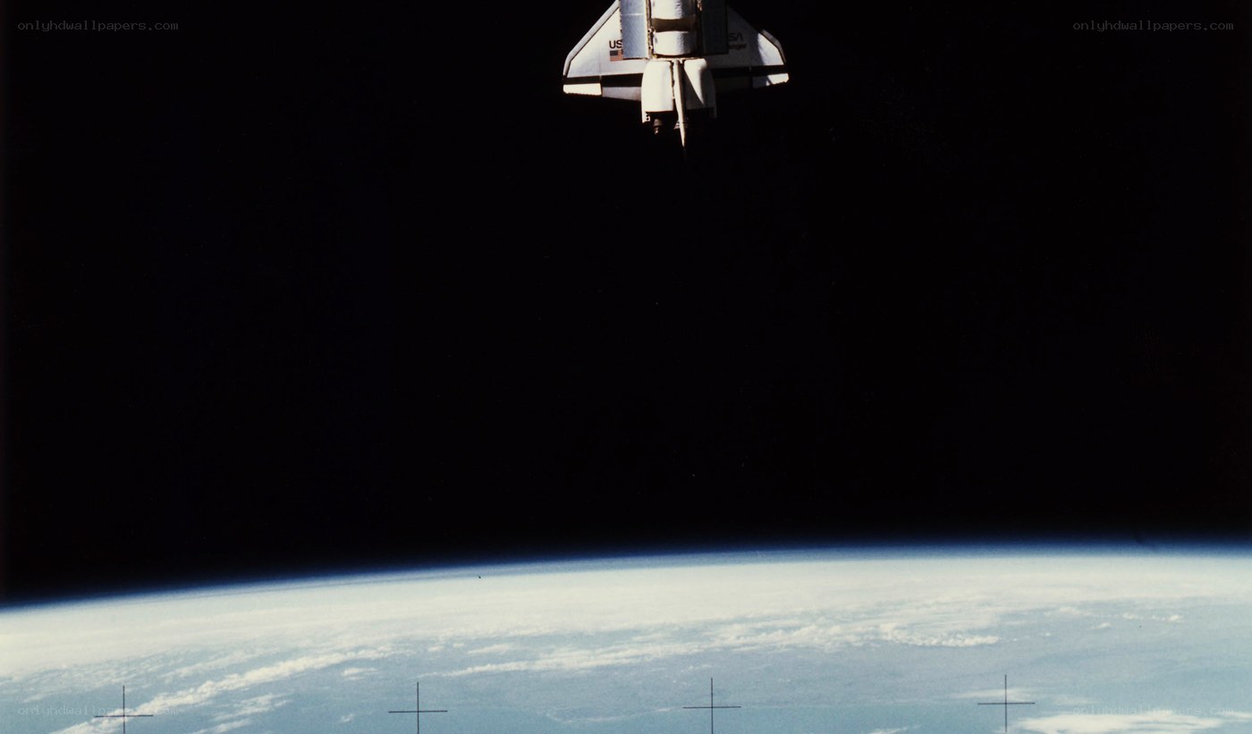 Space shuttle above Earth