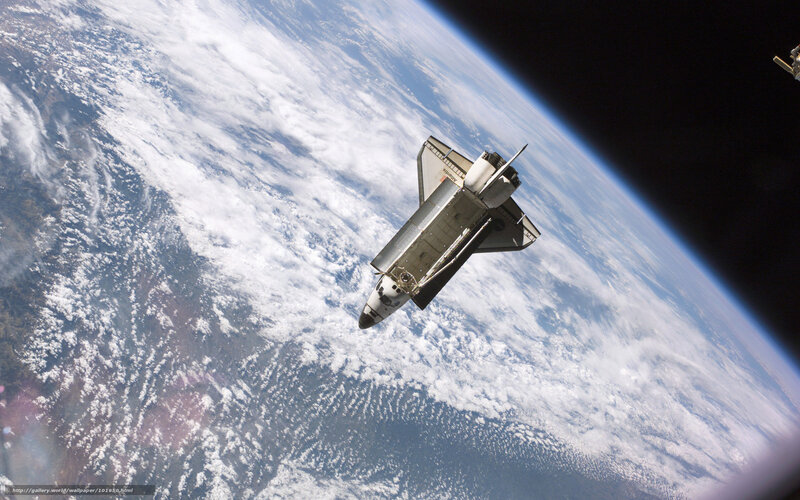 Space shuttle above Earth