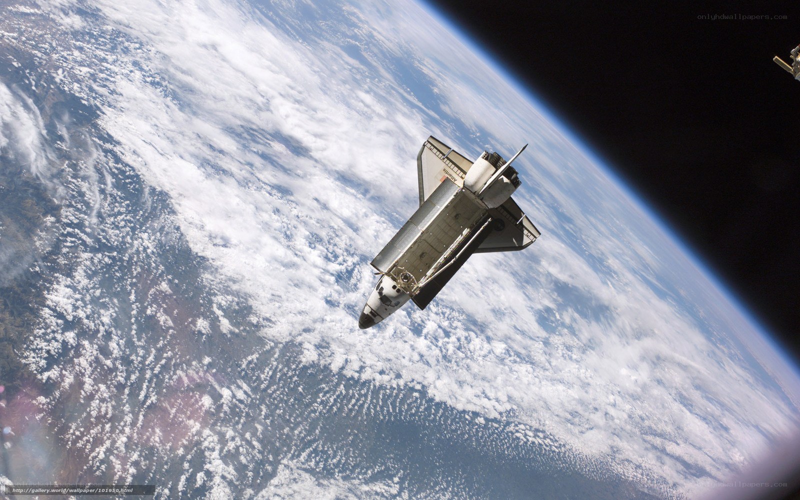 Space shuttle above Earth