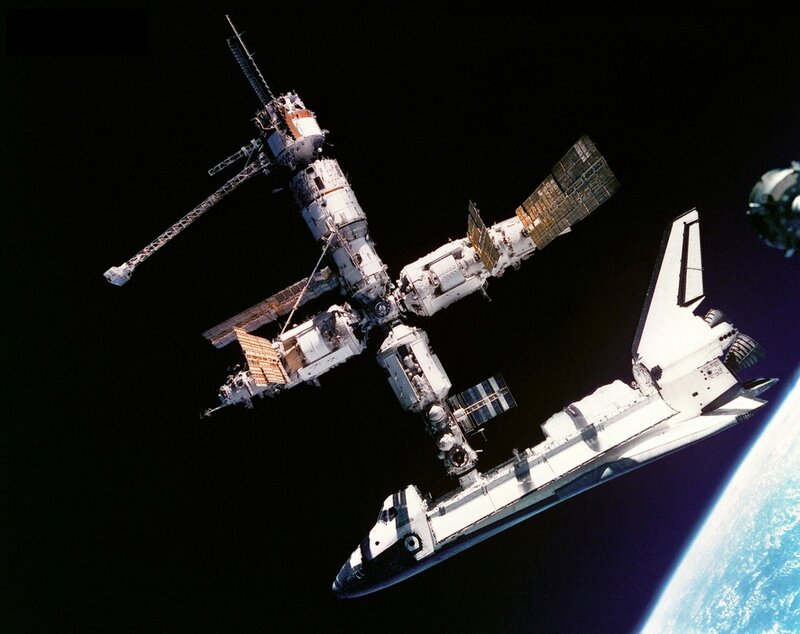 Space Shuttle and Space Station — White, Dramatic, Photograph, Earth, Solar Panels