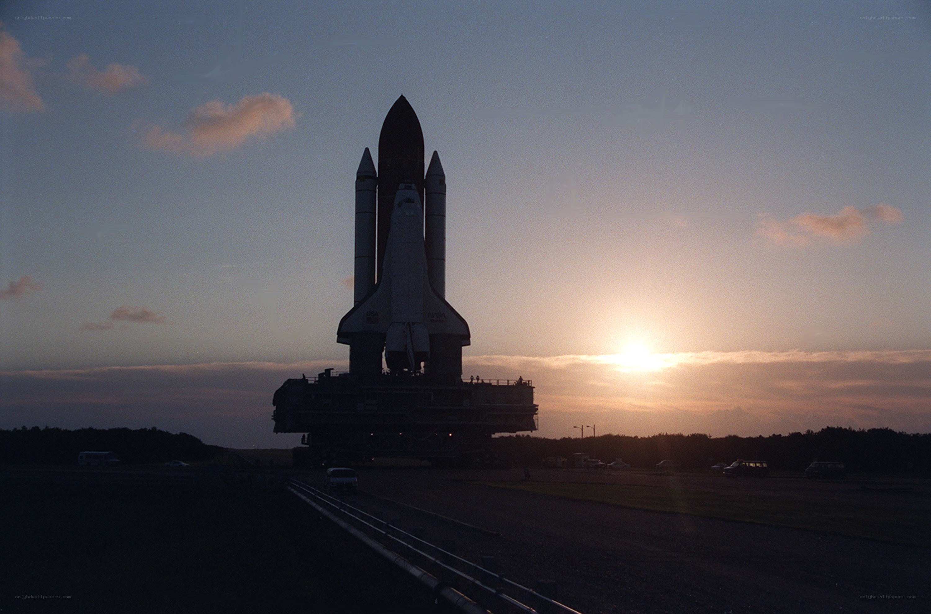 Space shuttle at sunset