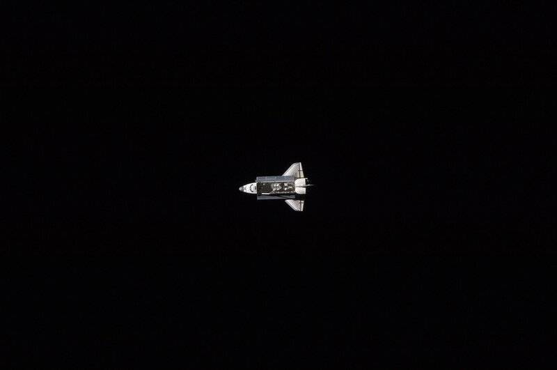 Space Shuttle in Orbit — Black, Dramatic